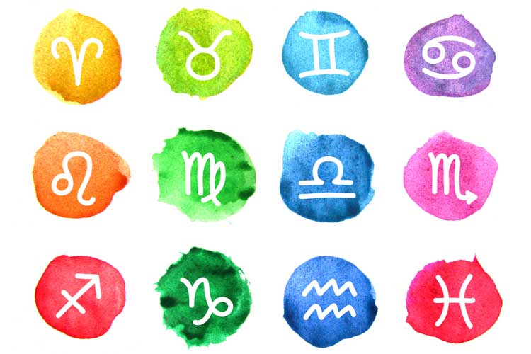 Símbolos do horóscopo estão sobre marcas de tinta coloridas